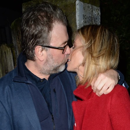 Kate Garraway kissing her hubsand Derek Draper.
